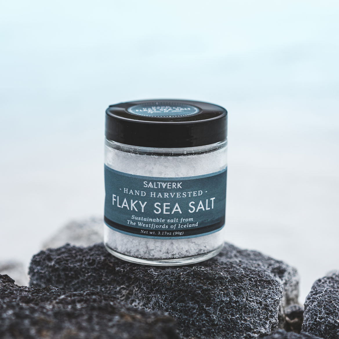 Flaky Icelandic sea salt sprinkled over the rugged Icelandic landscape, reflecting the purity and natural origin of Saltverk's sea salt